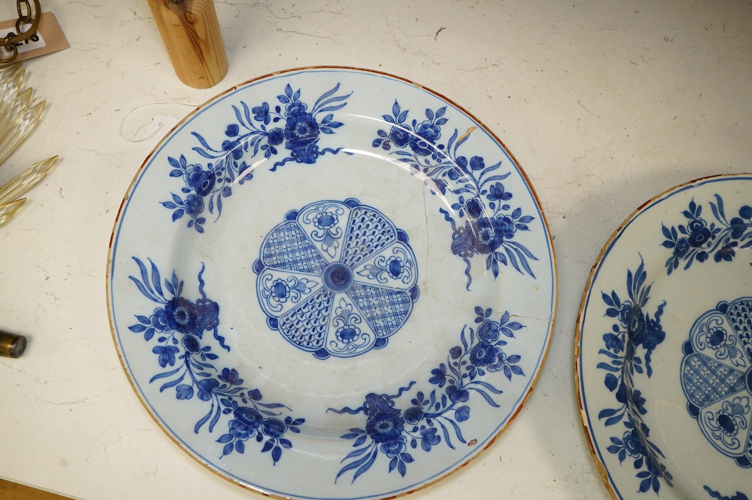 A pair of 18th century Delft plates, 30.5cm. Condition - poor